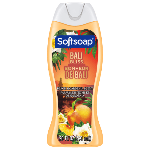 Front view of a 20 fl oz (591 mL) bottle of Softsoap Bali Bliss body wash. The label features a Balinese temple at sunset with peaches and gardenias. Text includes "Peach & Gardenia Scent" and "Parfum de pêche et de gardénia."