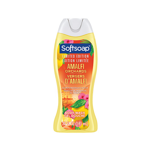 Front view of a 20-fluid-ounce bottle of Softsoap moisturizing body wash, "Amalfi Orchards" limited edition. The label depicts a Mediterranean orange grove scene, featuring orange trees, terracotta pots, and white flowers, set against a coastal landscape background.