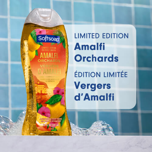 A bottle of Softsoap "Amalfi Orchards" moisturizing body wash (Limited Edition), placed against a background of blue tiles scattered with soap bubbles. The text reads "Limited Edition Amalfi Orchards" and "Édition Limitée Vergers d’Amalfi."