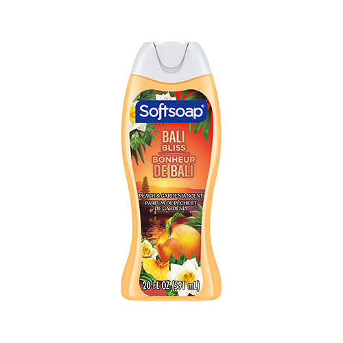 Front view of a 20 fl oz (591 mL) bottle of Softsoap Bali Bliss body wash. The label features a Balinese temple at sunset with peaches and gardenias. Text includes "Peach & Gardenia Scent" and "Parfum de pêche et de gardénia."