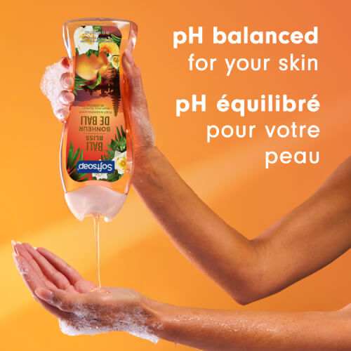 A person pours golden liquid body wash into their hand. Text in English and French reads: pH balanced for your skin. pH équilibré pour votre peau.