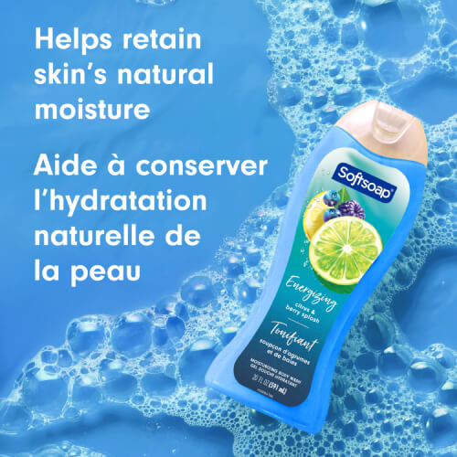 The Softsoap body wash bottle floating in clear blue water with white soap suds. Text overlay reads "Helps retain skin’s natural moisture" and "Aide à conserver l’hydratation naturelle de la peau."
