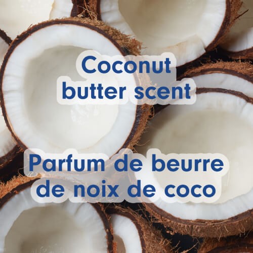 Close-up on the texture of pieces of fresh coconut and white coconut cream. Text in English and French: Made with real coconut oil.
