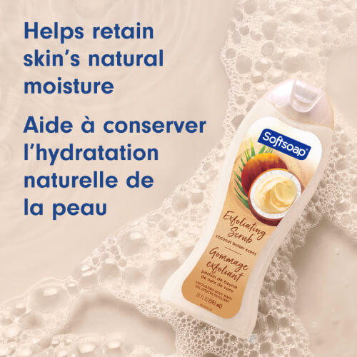 Softsoap Coconut Butter Scrub bottle on a soapy beige background. The text in English and French reads: Helps retain skin's natural moisture.
