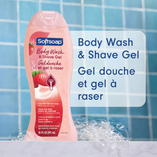 Softsoap Creamy Strawberry Body Wash and Shave Gel bottle in a bathroom setting. Text in English and French: Body Wash & Shave Gel, Gel douche et gel à raser.