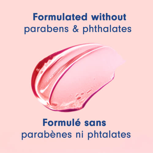 A swipe of translucent pink body wash gel is displayed against a light pink background. Text above and below the gel states "Formulated without parabens & phthalates" and "Formulé sans parabènes ni phtalates."