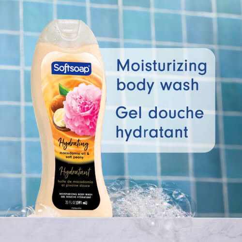 Softsoap Moisturizing Body Wash, Luminous Oils Macadamia Oil & Soft Peony, 591 mL bottle. The label features a pink peony and macadamia nuts.