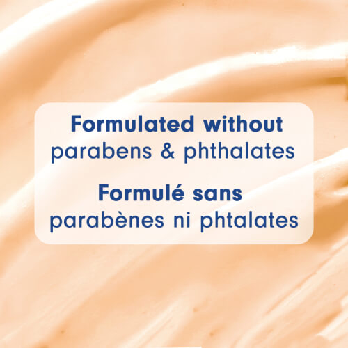 Close-up of a creamy, tan-colored soap texture. Text overlay: "Formulated without parabens & phthalates" and "Formulé sans parabènes ni phtalates."