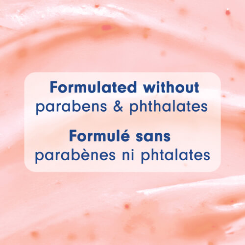 A macro close-up of the smooth, pink creamy texture of the body wash. A text box in the center states "Formulated without parabens & phthalates" and the French translation "Formulé sans parabènes ni phtalates."