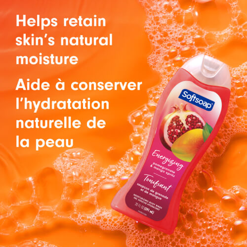 Softsoap Pomegranate and Mango Spritz bottle against a soapy orange background. The text in English and French reads: Helps retain skin's natural moisture.