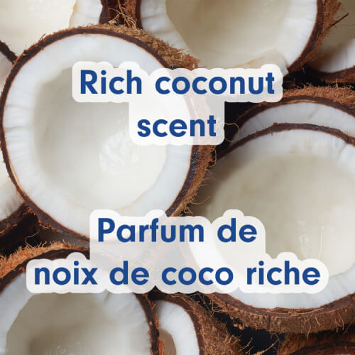 Multiple fresh, halved coconuts showing white meat. Text in English and French: Rich coconut scent, Parfum de noix de coco riche.