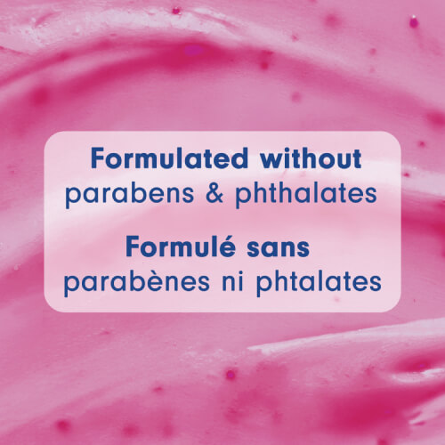 Macro background of pink exfoliating gel texture. A central text box reads "Formulated without parabens & phthalates" and "Formulé sans parabènes ni phtalates."